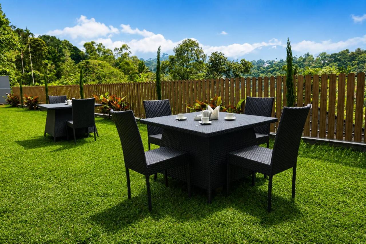 Outdoor lawn dining at The Signature Munnar
